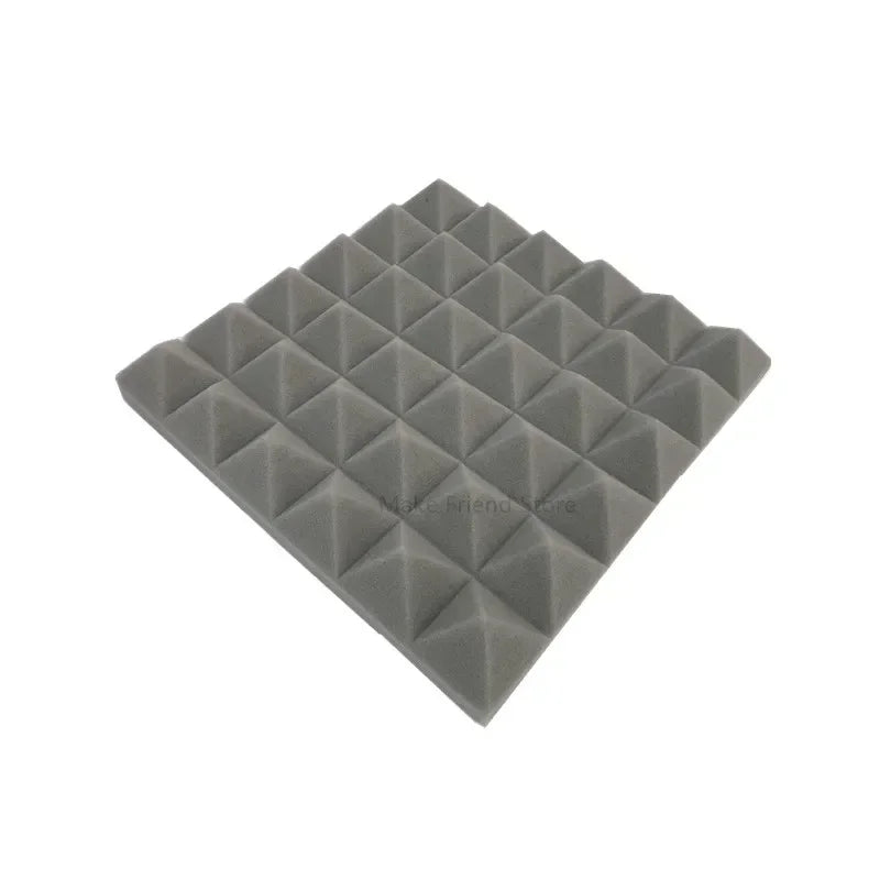 A pack of pyramid acoustic foam panels in black