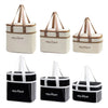 A set of black and beige insulated lunch bags with fabric handles.