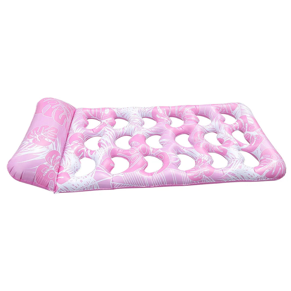 Pink inflatable pool float lounger with a headrest featuring a white floral pattern
