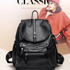 A black vintage faux leather women's backpack with multiple zippered compartments shown against a light background.