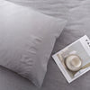 A soft gray microfiber pillowcase is shown next to a product information card.