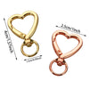 Gold heart-shaped spring hook keychain with a loop and jump ring.
