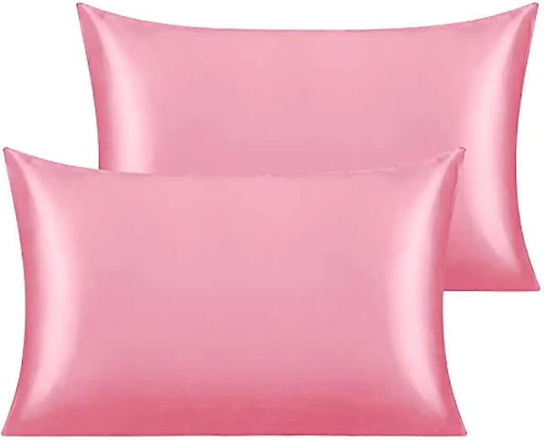 A stack of silky pink toddler pillowcases with hidden zippers.