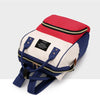 A red and navy insulated canvas mummy diaper bag with a hanging hook.