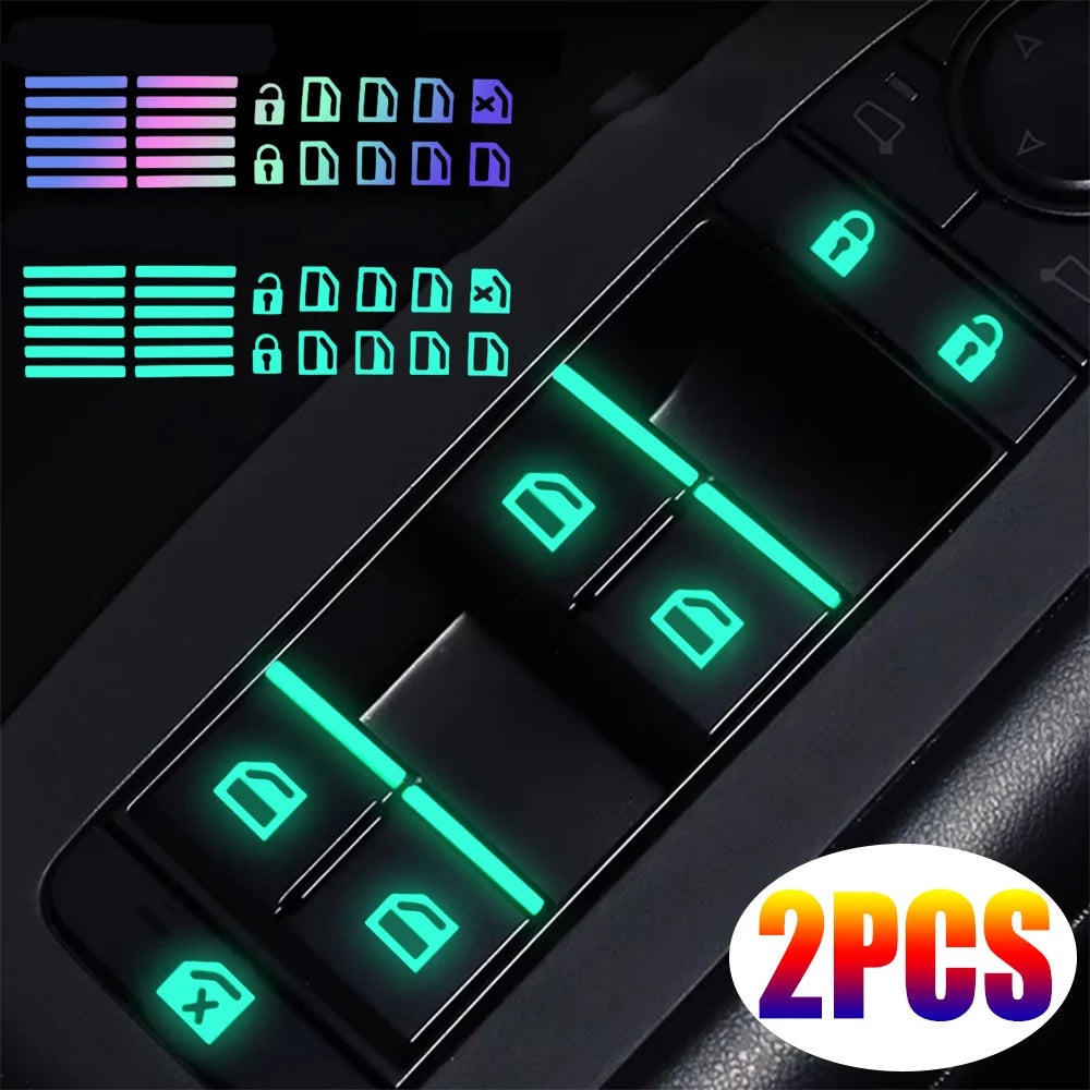 Close-up of glow-in-the-dark car window switch stickers and related components on a black device.