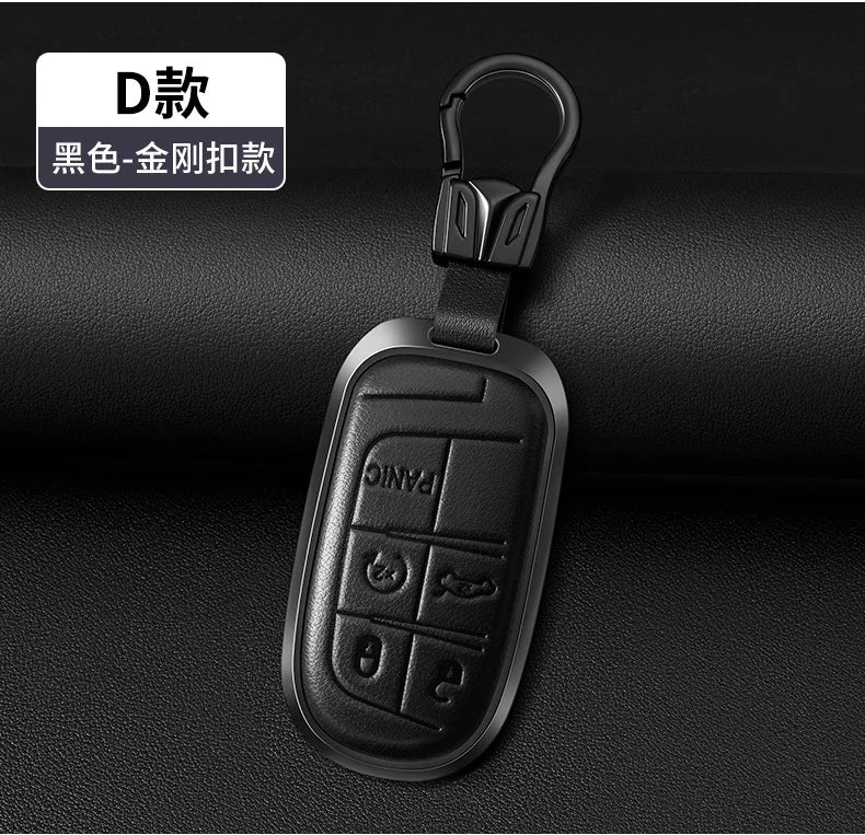 Black metal key fob with a split ring attached, designed for Jeep models.