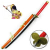 A cosplay sword replica of a katana with an orange and black blade and a yellow hilt, shown next to a figure.