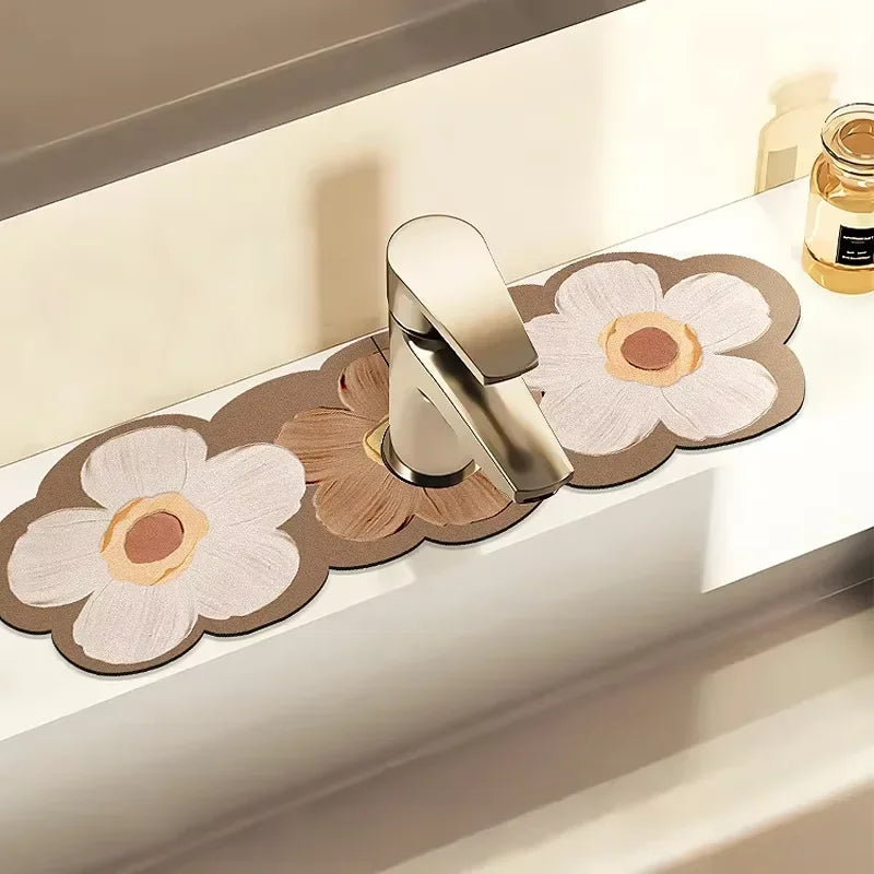 A modern silver faucet is placed on a wooden mat decorated with pressed floral patterns.