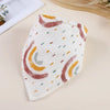 A white cotton baby bib with a pattern of orange, brown, and green abstract stripes.