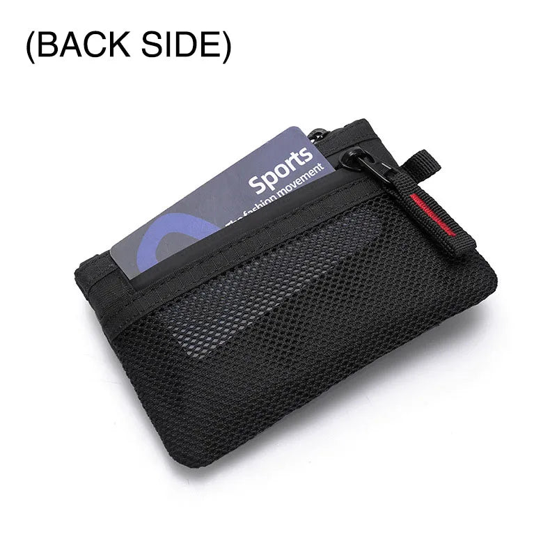 Black sports travel wallet with a zipper and carabiner clip shown from the back side