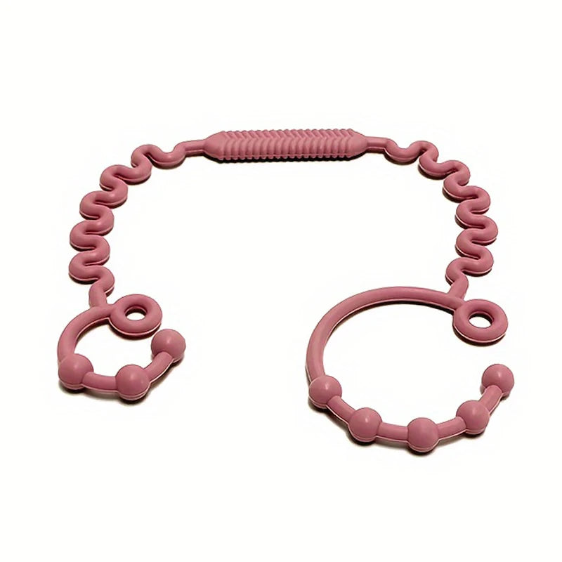 A pink silicone anti-drop pacifier clip with a teether, shaped like a loop and a ring.