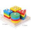 A set of colorful wooden stacking and sorting toys for toddlers, featuring five colored discs.