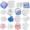 A set of silicone jewelry boxes and resin molds in various shapes and colors including pink, blue, and clear.