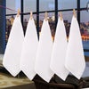 Five white soft cotton terry cloth face towels are hanging on a clothesline against a cityscape background.