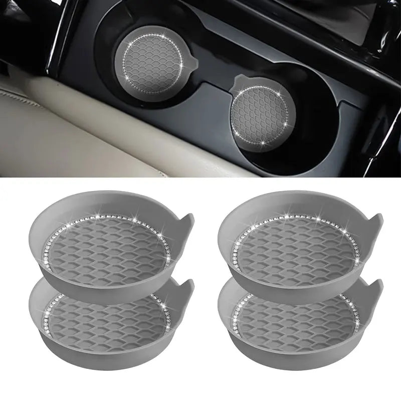 Set of three gray silicone coasters with rhinestone detailing for a car cup holder