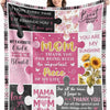 A pink fleece throw blanket featuring various heartfelt messages and floral designs for a mom