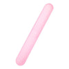 A pink portable toothbrush travel case with a smooth, elongated cover.