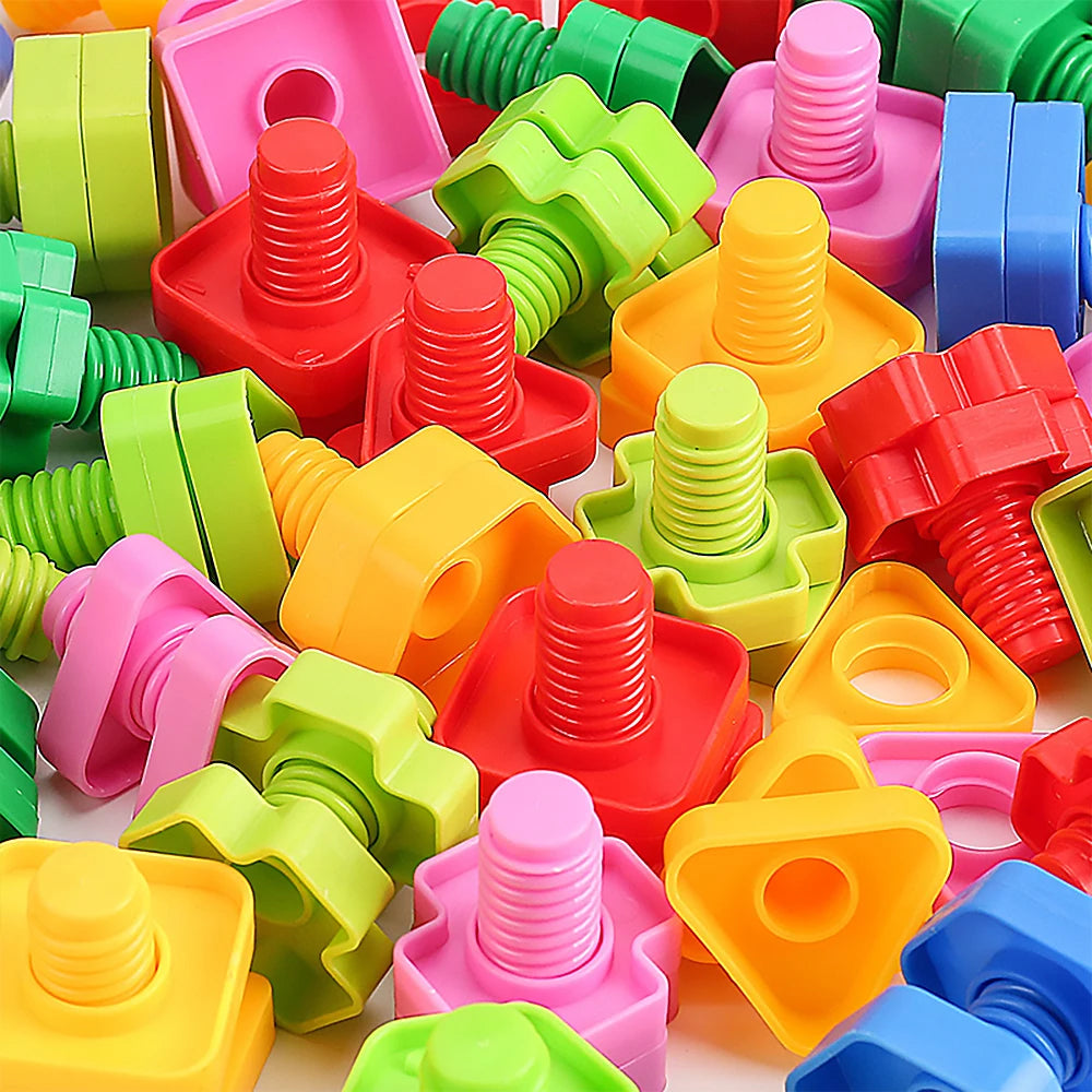 A collection of colorful plastic screw and nut building blocks for kids in various shades of pink, green, orange, and red.