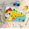 A wooden farm animal assembly toy featuring a tractor, pumpkin, and other animals with tools.