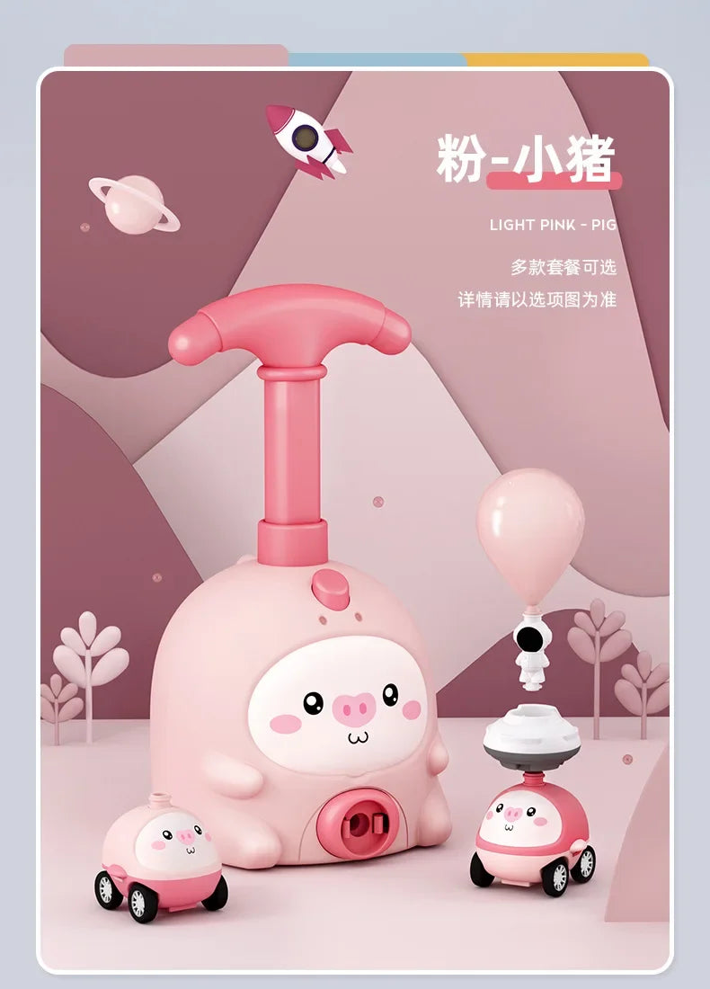 A pink balloon-powered racing car science toy with an air pump and a larger version of the toy.