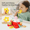 A baby is using a soft and chewy teether toy with multiple biting points for oral needs.
