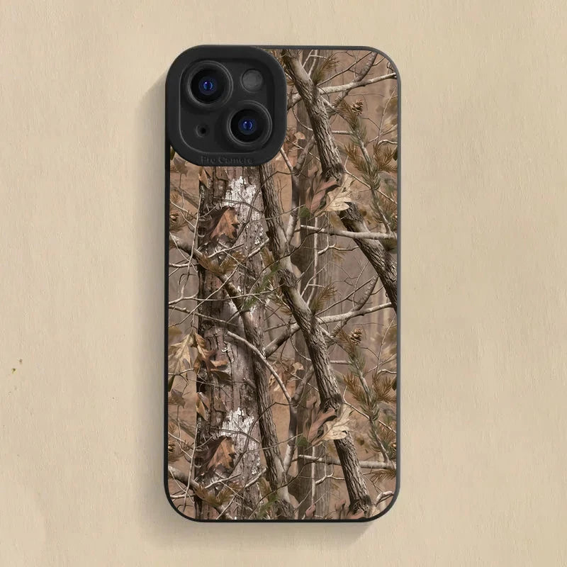 A silicone phone case featuring a forest camouflage pattern on the back, shown against a light background.