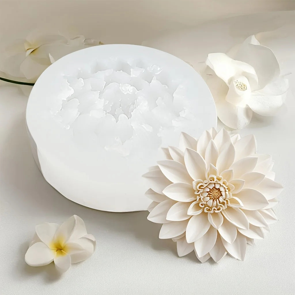 White lotus flower silicone mold resting on a light surface with fresh white flowers.