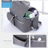 A gray insulated lunch bag with an open pocket showing various items and a separate oblique plug bag.