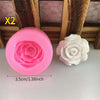 Two pink and white rose bloom silicone molds for chocolates, candy, and fondant