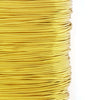 A spool of bright yellow copper clad steel sculpting wire used for craft and jewelry making.