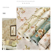 Roll of 3D embossed floral self-adhesive wallpaper in soft gray and green tones