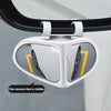 A white blind spot mirror is shown mounted on a car, with a visible yellow reverse line.