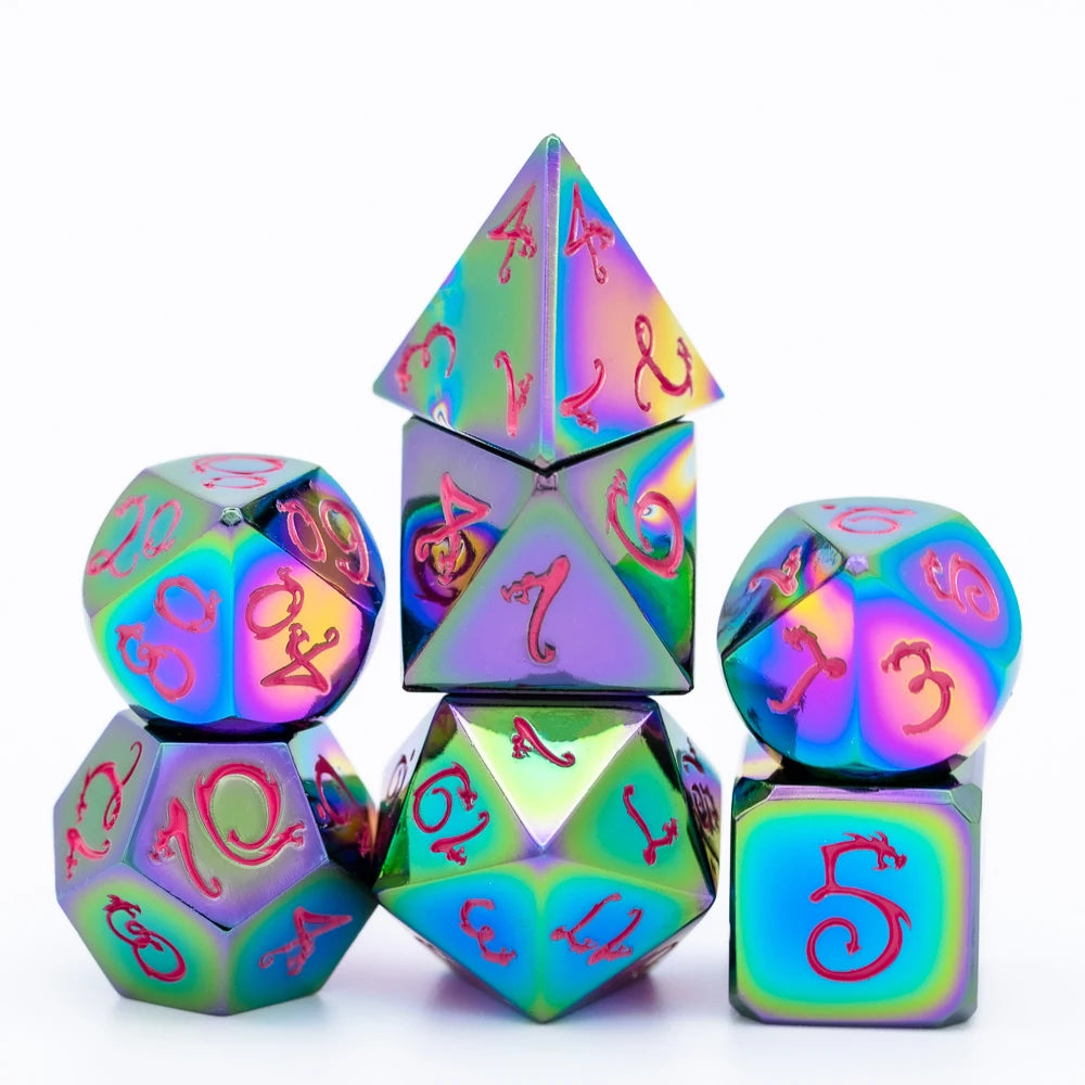 A set of seven metal polyhedral dice with a dragon font design, featuring iridescent and holographic colors.
