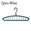 A pair of blue foldable multi-hole space-saving clothes hangers.