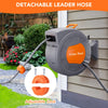 A gray detachable leader hose and hose reel are shown mounted on a wooden fence, with an orange nozzle visible.