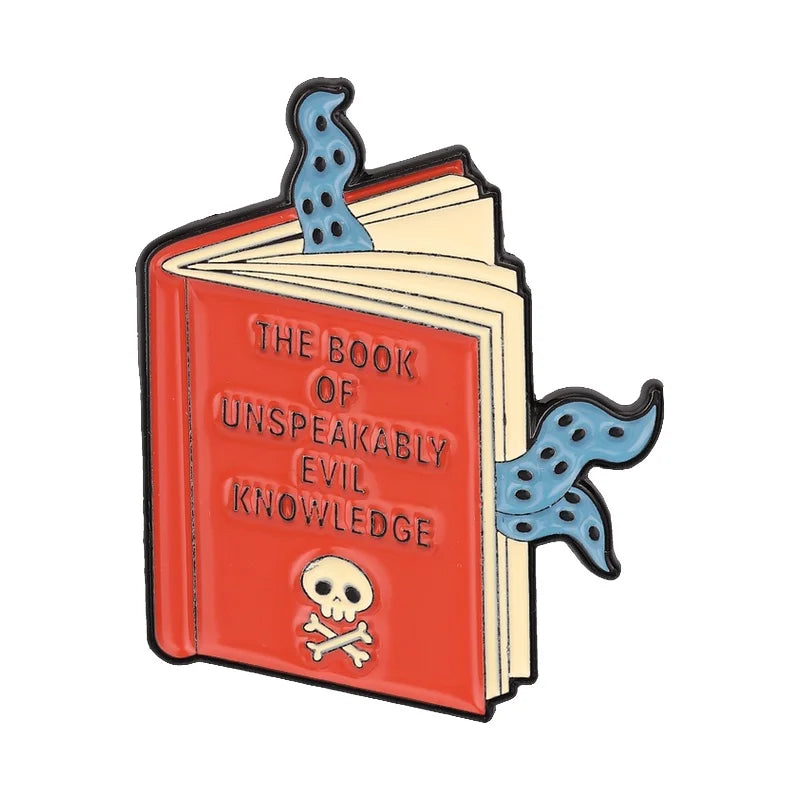 Enamel pin featuring a red book with a skull and crossbones design and blue liquid elements.