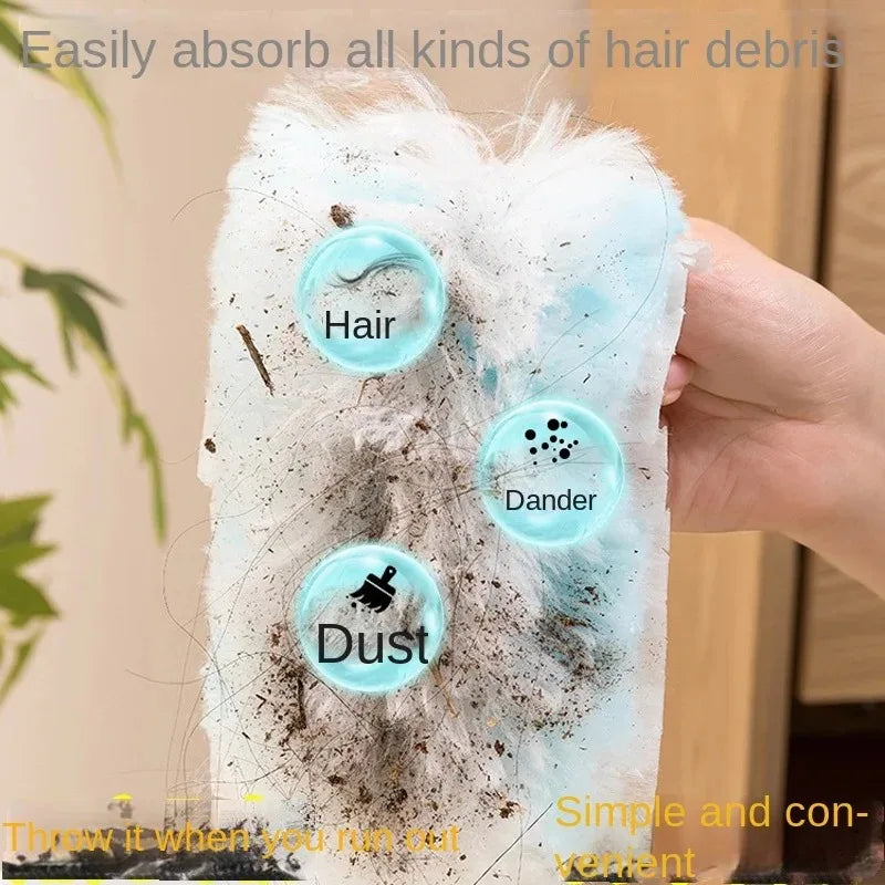 A hand holds a blue electrostatic dusting refill with fiber heads, demonstrating its ability to absorb hair debris, dander, a
