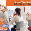 A woman uses a multi-heat electric heating pad for pain relief while sitting in a chair.