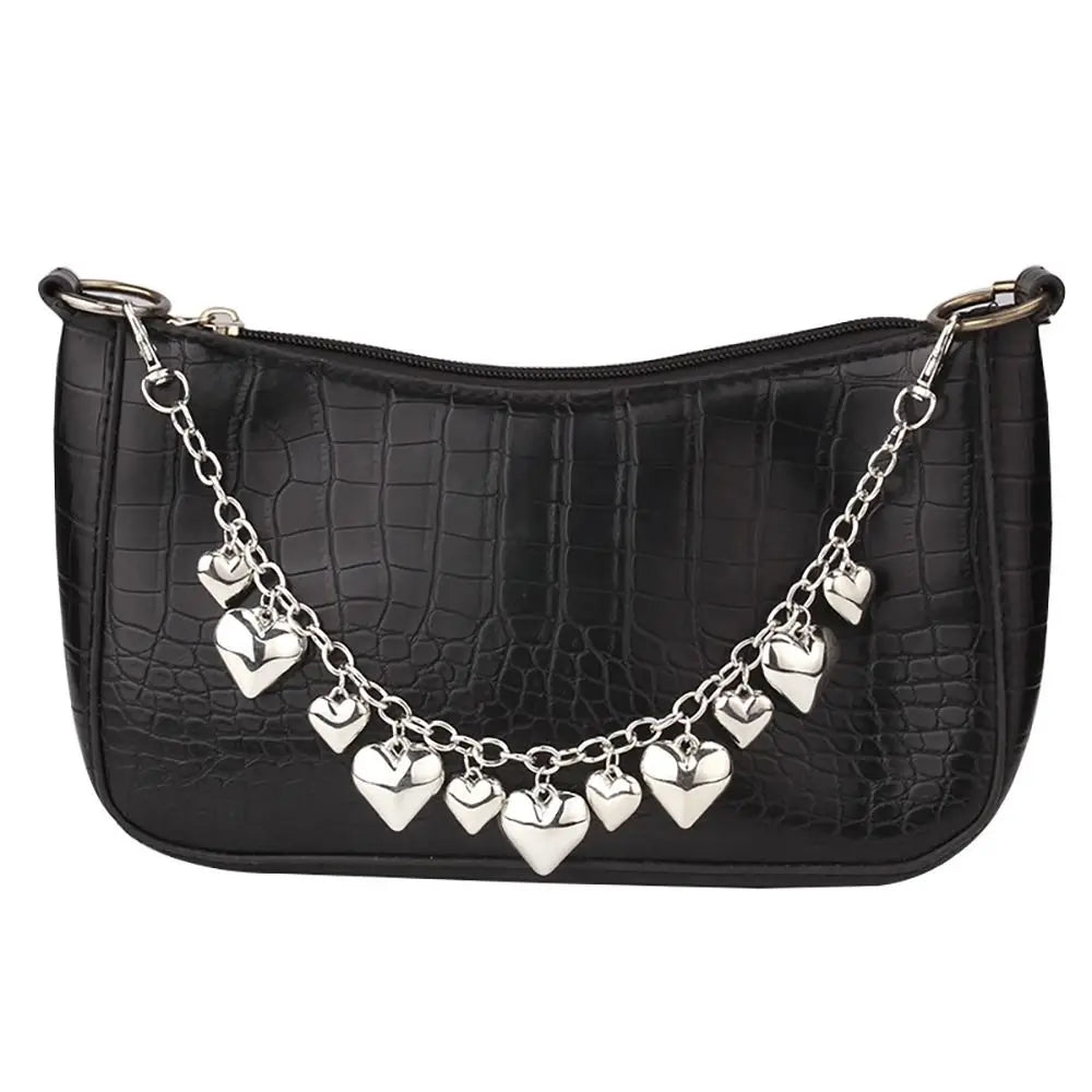 Black crocodile print handbag with an elegant metal chain strap