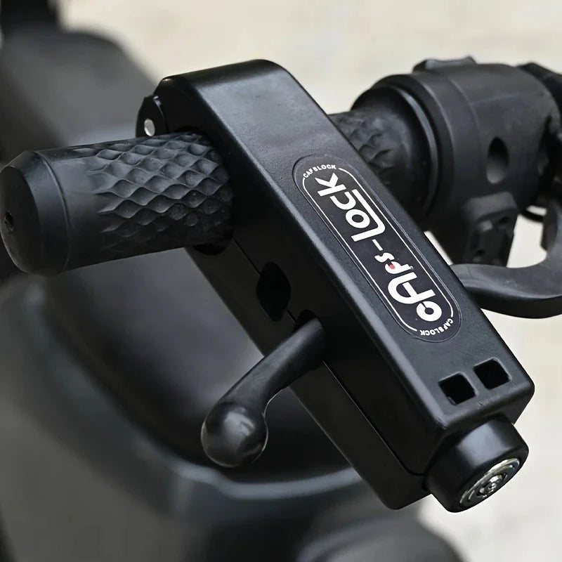 A close-up view of a black QPS lock with a textured handle, designed for securing bikes and scooters.