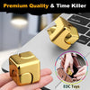 A gold alloy metal fidget cube spinner toy is shown on a laptop and in a hand.