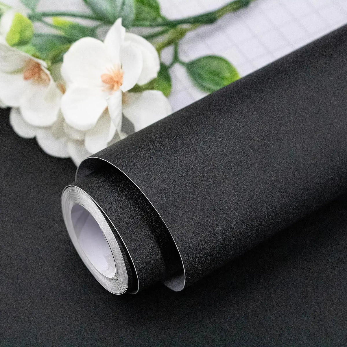 Roll of self-adhesive matte green vinyl film for furniture and wall renovation