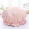Pink reusable elastic shower cap for women with gold polka dots
