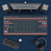 A set of mechanical gaming peripherals including a mouse, keyboard, headset, and large mouse pads on a dark surface.