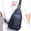 Navy blue men's adjustable crossbody chest bag worn by a person.