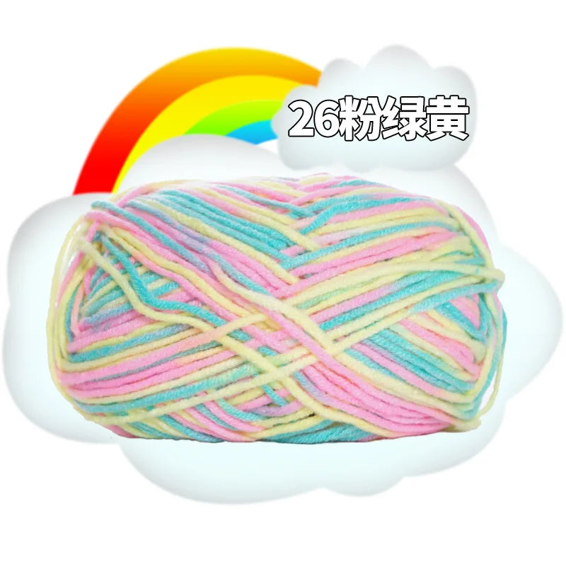 A ball of multi-colored milk cotton blend yarn with a rainbow background and Japanese text.