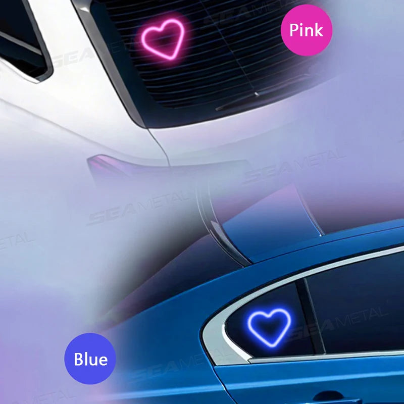 A close-up view of a blue car with pink and blue ambient heart lights visible on the grille and body.