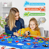 A young girl is interacting with a felt storytelling board set featuring various zoo animals like a shark, fish, and other cr