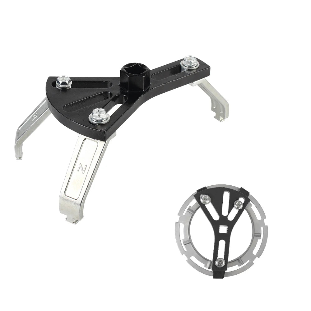 Clé à douille noire réglable pour pompe à carburant avec douille de serrage argentée et outil annulaire correspondant.