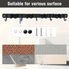 Black heavy-duty wall-mounted tool rack with 4 slots and 5 hooks shown against various surfaces.